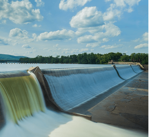 Hydropower facility generating renewable energy from flowing water, representing commitment to sustainable energy – GCG Hydro