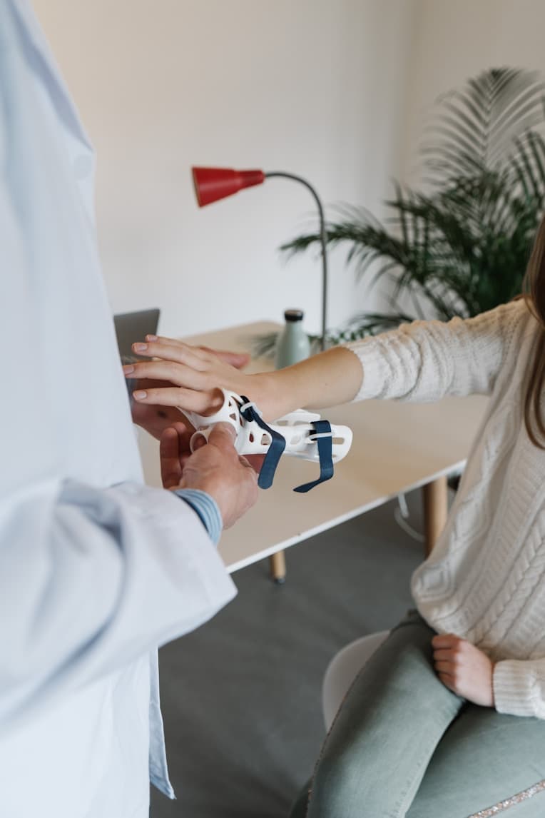 Doctor examining a patient with a stethoscope in a hospital room, focusing on the patient’s health and well-being – GCG Healthcare.